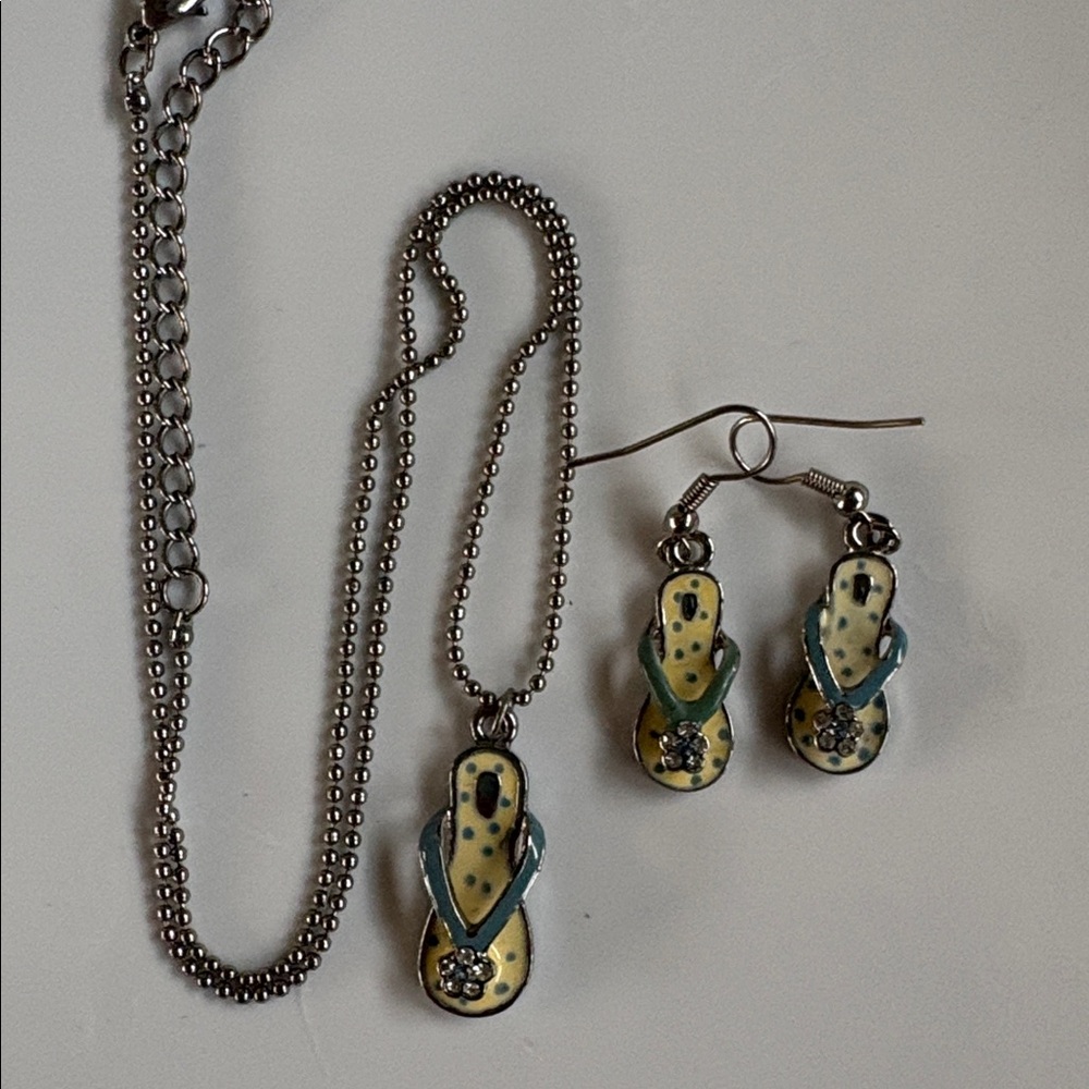Elegant Silver tone necklace with yellow /blue flip flops and matching earrings